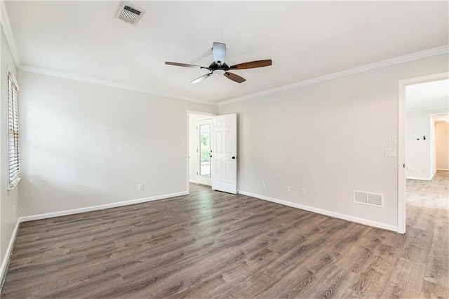 unfurnished room with ceiling fan, wood finished floors, baseboards, and crown molding