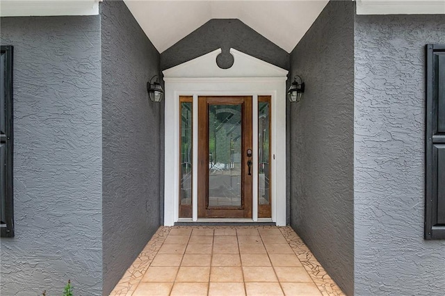 entrance to property with stucco siding