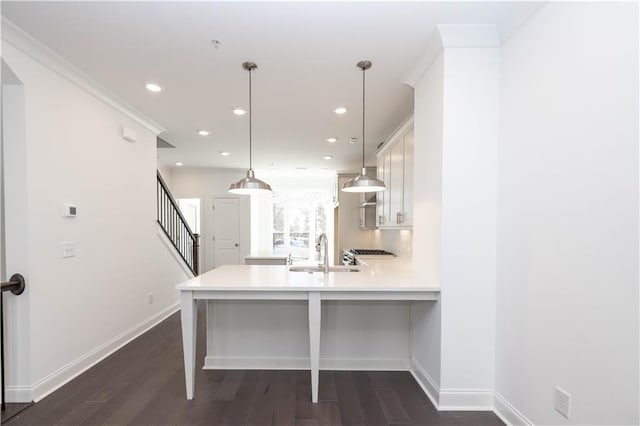 352 Olmstead Way Unit 28, Alpharetta, GA 30022 - kitchen with a peninsula, light countertops, recessed lighting, dark wood-style floors, and white cabinetry
