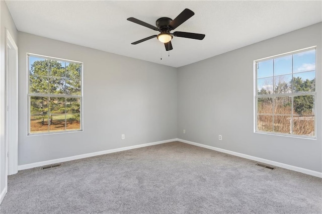 unfurnished room featuring carpet flooring and ceiling fan