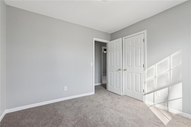 unfurnished bedroom with light carpet