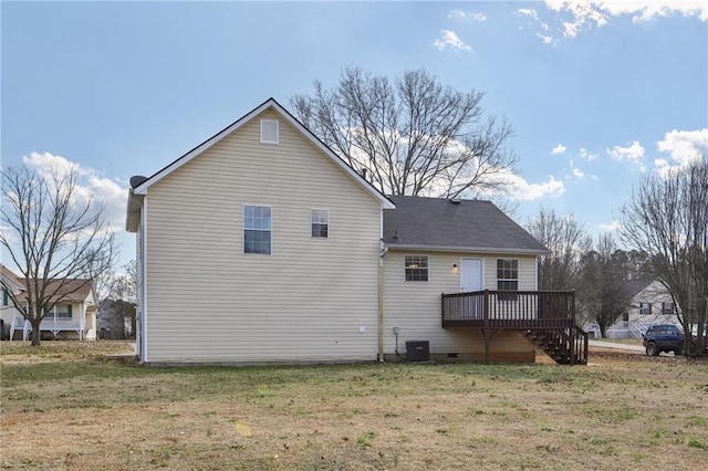 back of property featuring cooling unit, a deck, and a yard