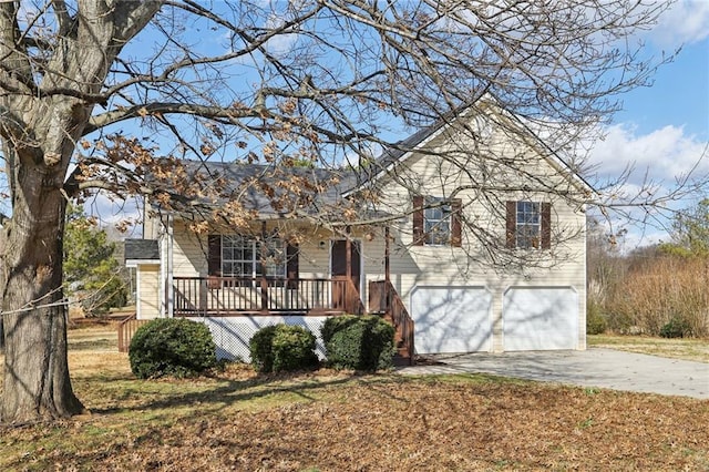 view of front of house featuring a porch and a garage