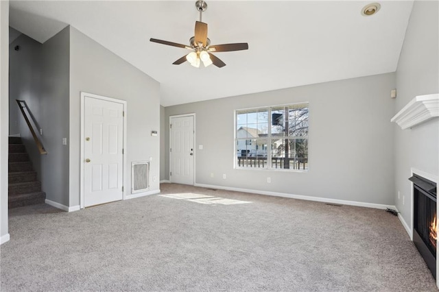 unfurnished living room with ceiling fan, light carpet, and high vaulted ceiling