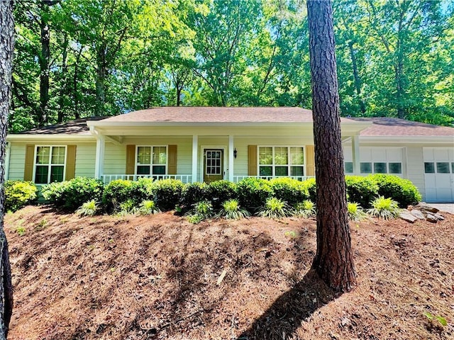 3436 Finglas Dr, Marietta, GA 30008 - ranch-style house featuring an attached garage and a porch