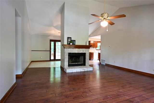 3436 Finglas Dr, Marietta, GA 30008 - unfurnished living room with hardwood / wood-style floors, baseboards, a ceiling fan, and high vaulted ceiling