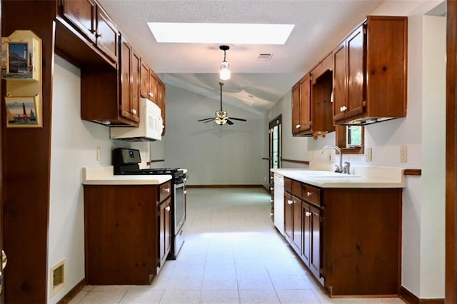 3436 Finglas Dr, Marietta, GA 30008 - kitchen featuring white appliances, a sink, lofted ceiling, a skylight, and light countertops