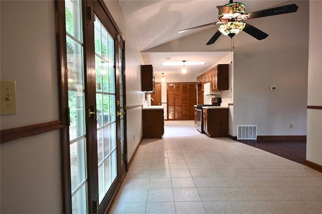 3436 Finglas Dr, Marietta, GA 30008 - unfurnished living room featuring lofted ceiling, ceiling fan, light tile patterned flooring, and baseboards