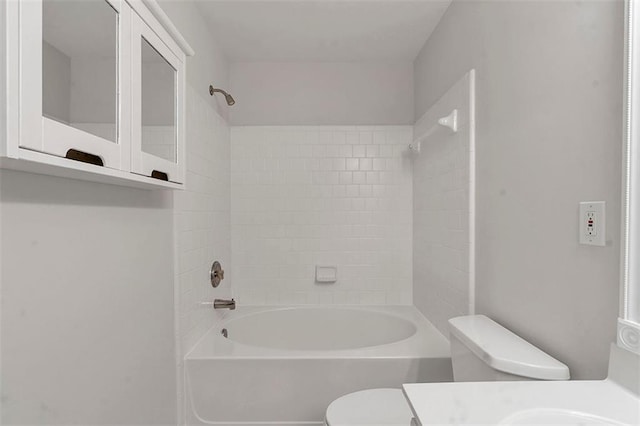 bathroom featuring vanity, toilet, and shower / bathtub combination