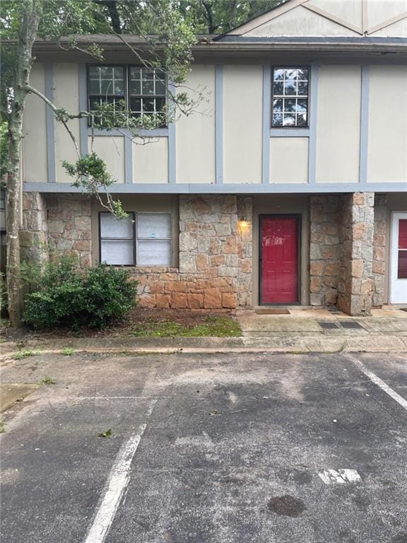 1150 Rankin St Unit D1, Stone Mountain, GA 30083 - view of front of home with stone siding, uncovered parking, and stucco siding