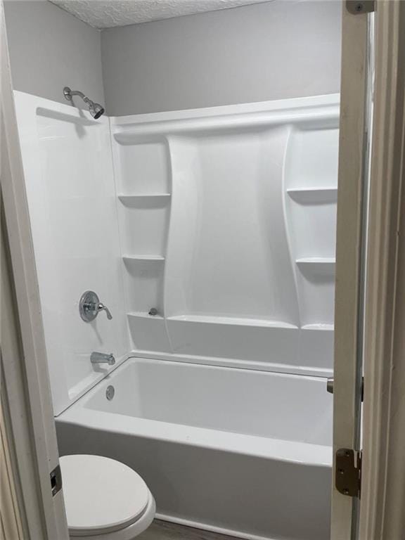 1150 Rankin St Unit D1, Stone Mountain, GA 30083 - full bathroom with washtub / shower combination and a textured ceiling