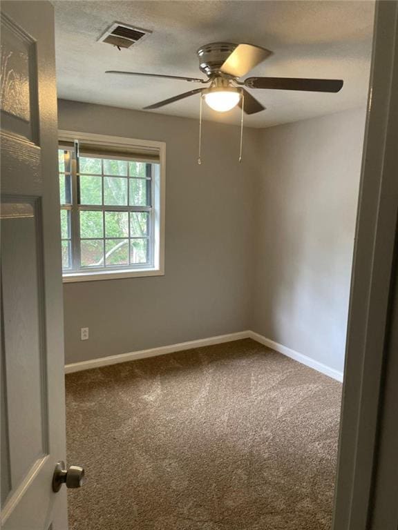 1150 Rankin St Unit D1, Stone Mountain, GA 30083 - empty room featuring ceiling fan, carpet, and a textured ceiling