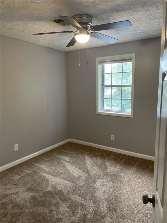 1150 Rankin St Unit D1, Stone Mountain, GA 30083 - spare room featuring ceiling fan, carpet, and a textured ceiling