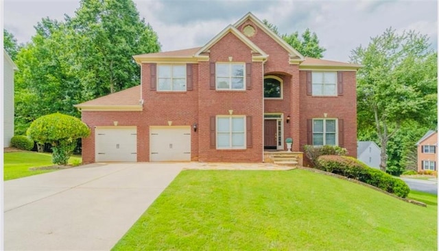 10950 Glenhurst, Duluth, GA 30097 - colonial house with concrete driveway, a front lawn, brick siding, and a garage