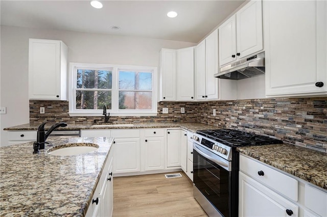 10950 Glenhurst, Duluth, GA 30097 - kitchen featuring stainless steel range with gas stovetop, under cabinet range hood, stone countertops, white cabinets, and recessed lighting