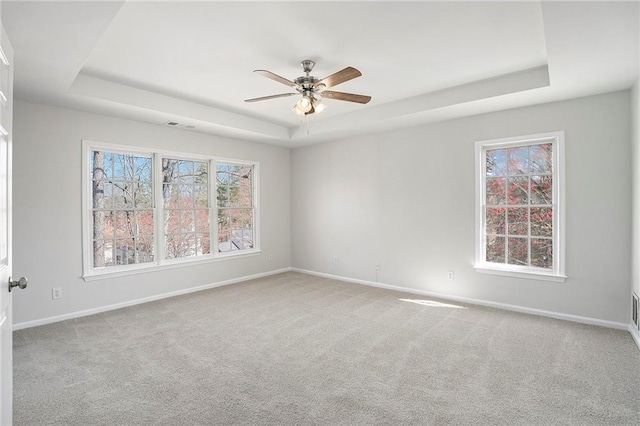 10950 Glenhurst, Duluth, GA 30097 - unfurnished room with a tray ceiling, ceiling fan, and carpet flooring