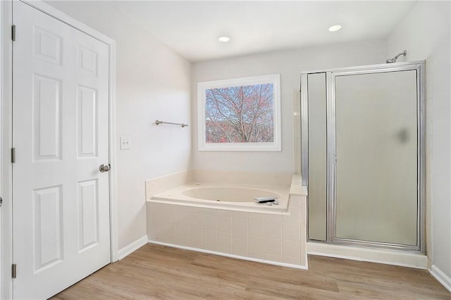 10950 Glenhurst, Duluth, GA 30097 - full bathroom featuring a garden tub, a stall shower, and wood finished floors