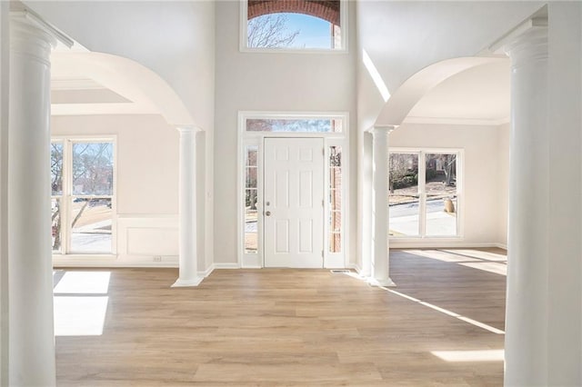 10950 Glenhurst, Duluth, GA 30097 - entrance foyer with decorative columns, crown molding, healthy amount of natural light, and wood finished floors
