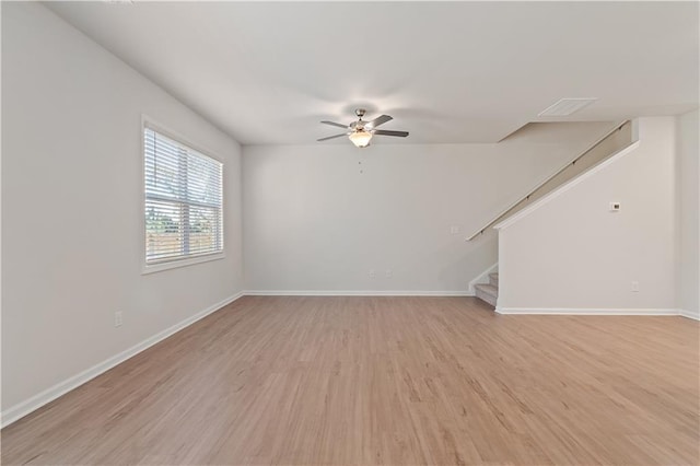 empty room featuring ceiling fan and light wood-type flooring