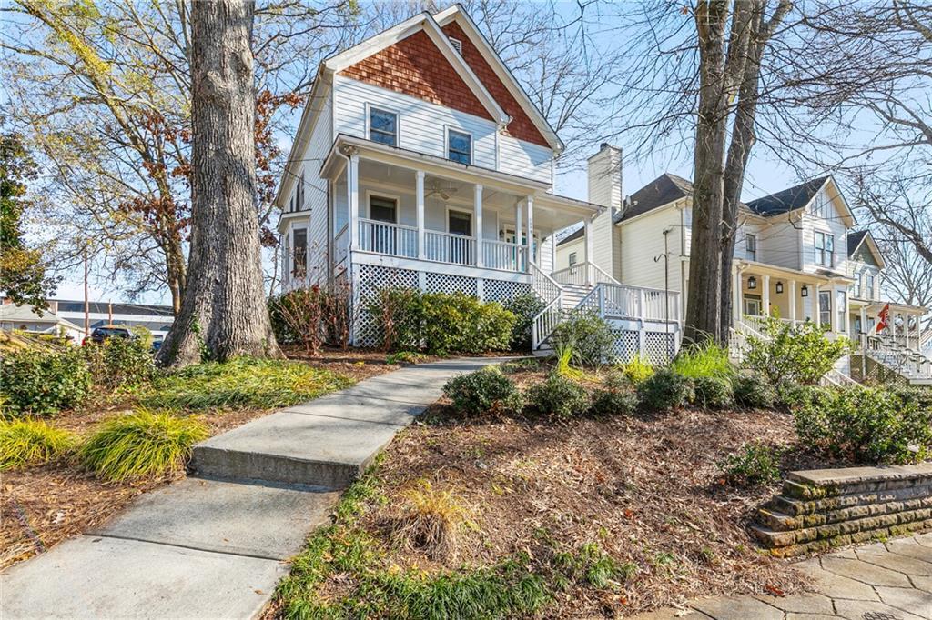 view of property featuring covered porch