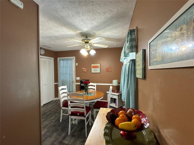 2671 Club Forest Ct SE, Conyers, GA 30013 - dining room featuring a textured ceiling, a ceiling fan, and wood finished floors