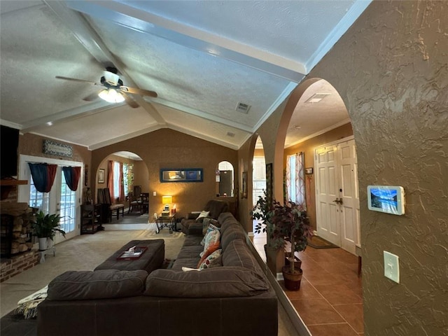 2671 Club Forest Ct SE, Conyers, GA 30013 - living room featuring arched walkways, ceiling fan, a textured wall, ornamental molding, and tile patterned floors