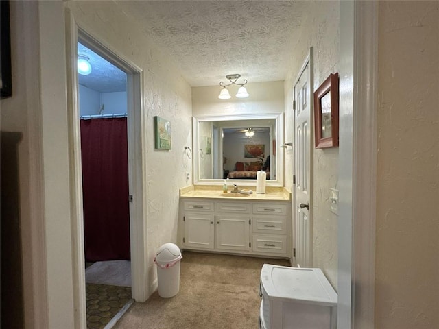 2671 Club Forest Ct SE, Conyers, GA 30013 - ensuite bathroom with a textured ceiling, a textured wall, and vanity