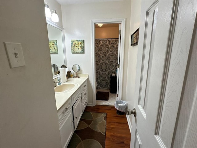 2671 Club Forest Ct SE, Conyers, GA 30013 - full bath with wood finished floors, vanity, and curtained shower
