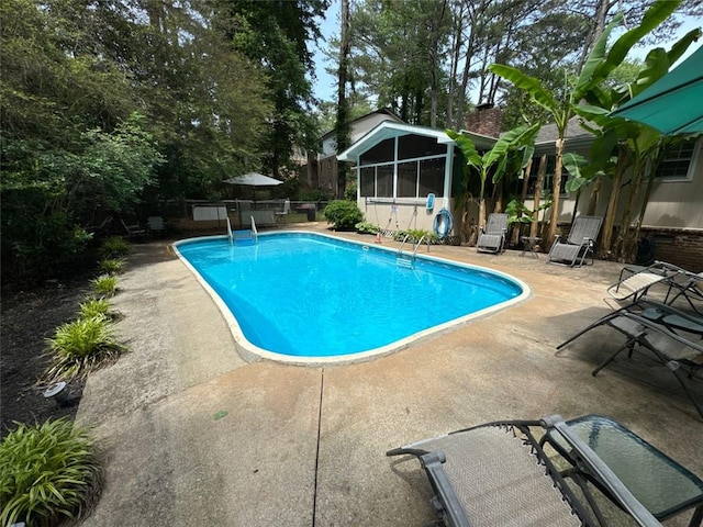 2671 Club Forest Ct SE, Conyers, GA 30013 - view of pool with a sunroom and a patio