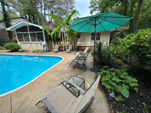 2671 Club Forest Ct SE, Conyers, GA 30013 - outdoor pool with a patio and a sunroom