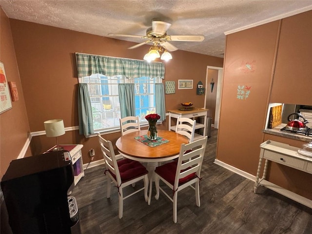 2671 Club Forest Ct SE, Conyers, GA 30013 - dining area with a textured ceiling, dark wood-type flooring, ceiling fan, and baseboards