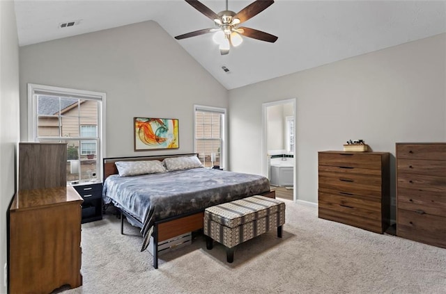 bedroom with high vaulted ceiling, multiple windows, visible vents, and light carpet