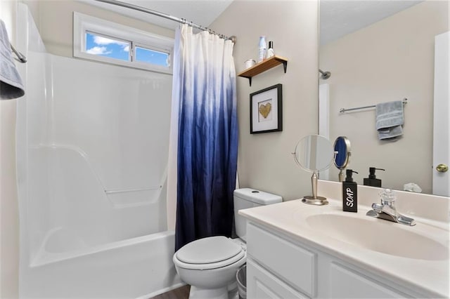 full bath featuring vanity, shower / bath combination with curtain, and toilet