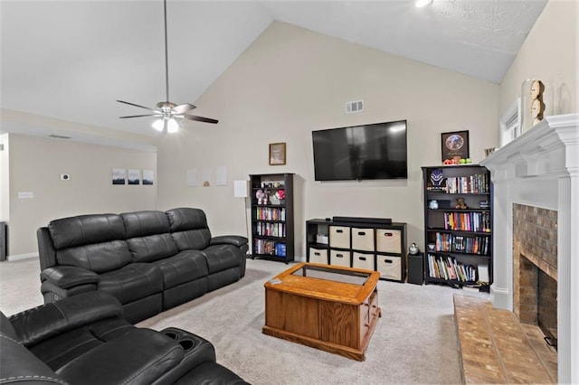 living room featuring carpet flooring, a brick fireplace, a ceiling fan, and visible vents