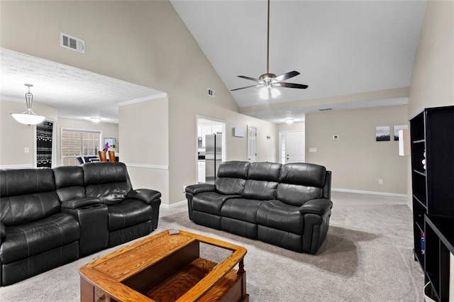 living area with visible vents, carpet flooring, high vaulted ceiling, and baseboards