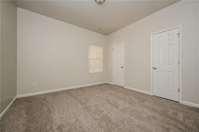 spare room featuring carpet flooring