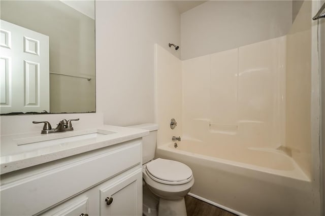 full bathroom featuring vanity, toilet, shower / washtub combination, and wood-type flooring