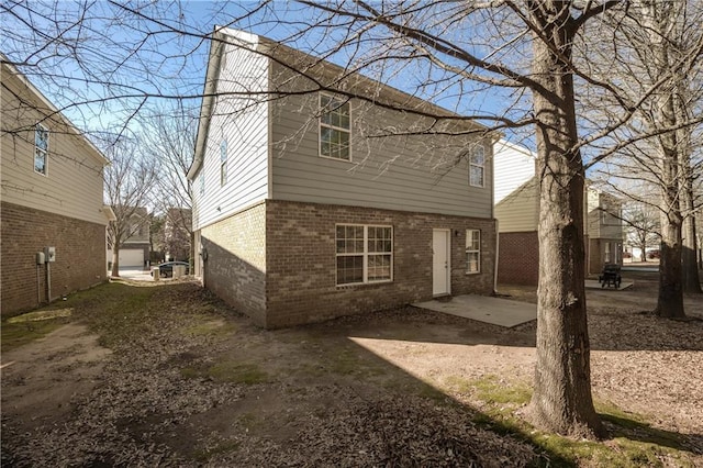 back of property featuring a patio