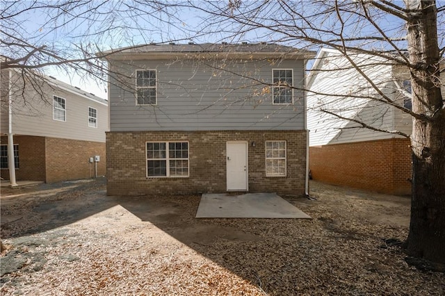 rear view of house featuring a patio