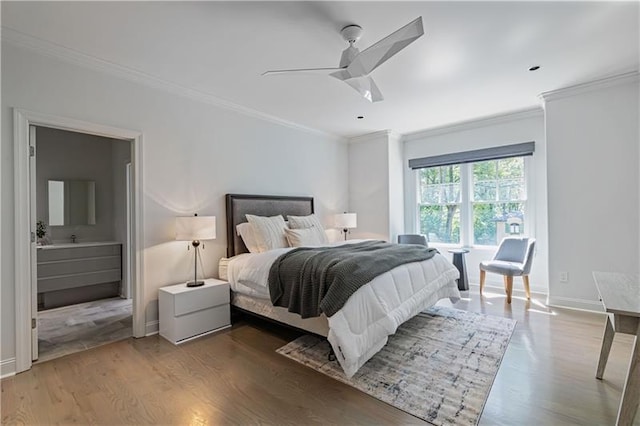 bedroom featuring ceiling fan, ornamental molding, wood finished floors, and baseboards