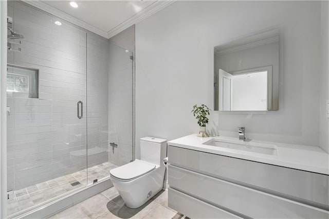 full bathroom featuring vanity, a shower stall, toilet, and crown molding