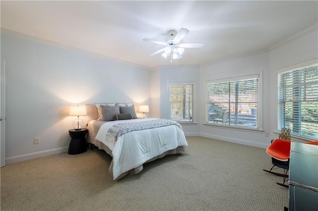 bedroom featuring ornamental molding, carpet, a ceiling fan, and baseboards