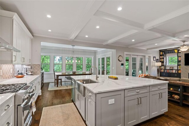 629 2nd Ave, Decatur, GA 30030 - kitchen with a sink, stainless steel range, open floor plan, dark wood finished floors, and recessed lighting