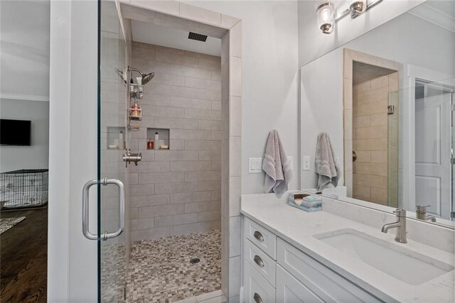 629 2nd Ave, Decatur, GA 30030 - bathroom with a shower stall, crown molding, vanity, and wood finished floors