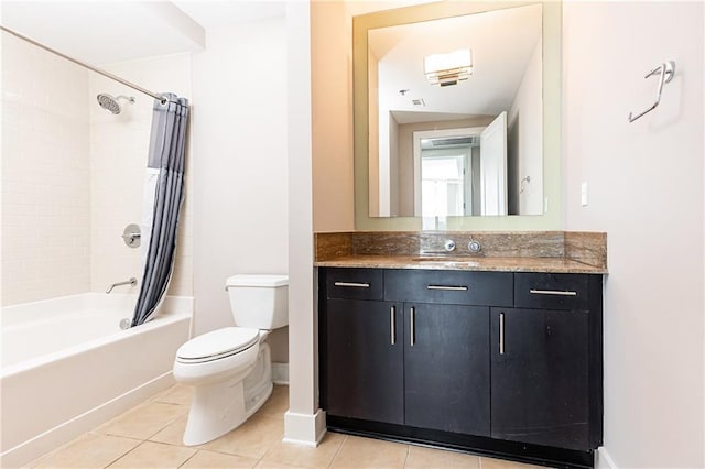 bathroom featuring tile patterned flooring, toilet, shower / bath combo, vanity, and baseboards