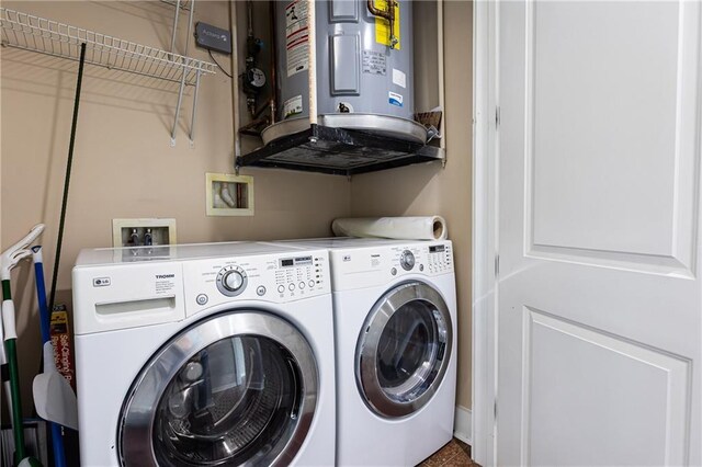 washroom featuring washer and dryer and water heater