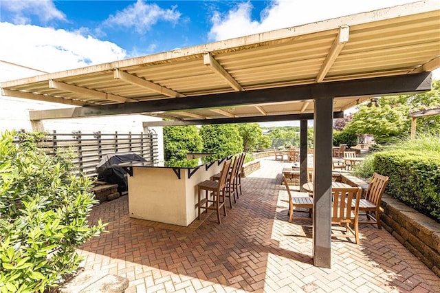 view of patio featuring fence
