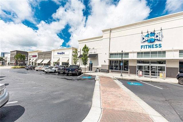 view of commercial location featuring uncovered parking