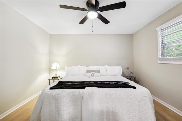 bedroom featuring ceiling fan and light wood-type flooring