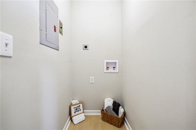 washroom featuring washer hookup, light wood-type flooring, electric panel, and electric dryer hookup